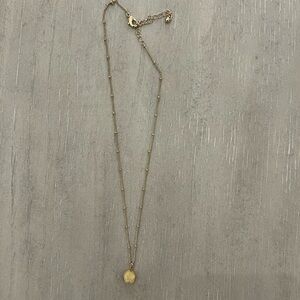 Gold necklace with yellow stone